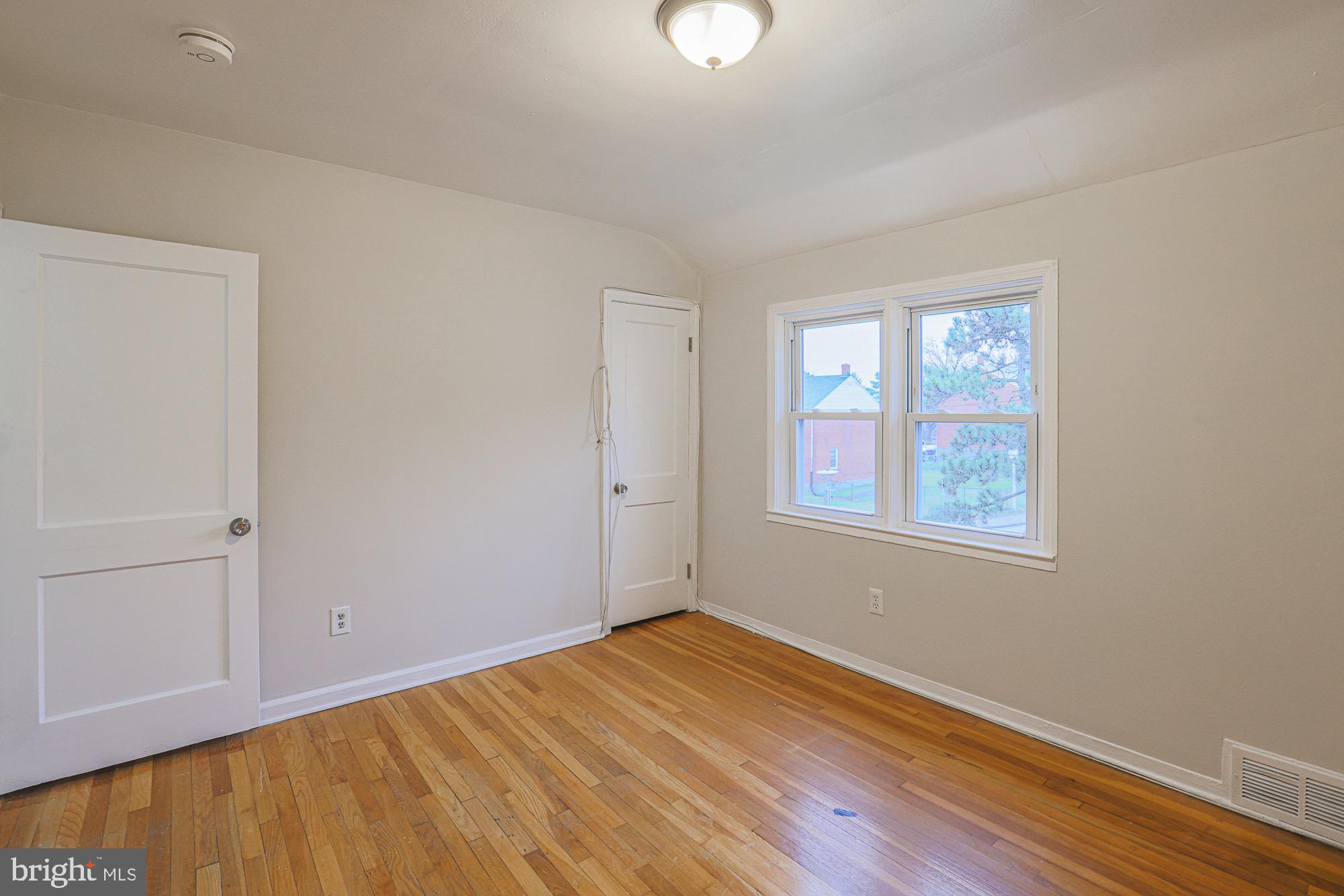 1022 Cameron Road Baltimore, MD 21212 - Photo 10 of 21 an empty room with windows