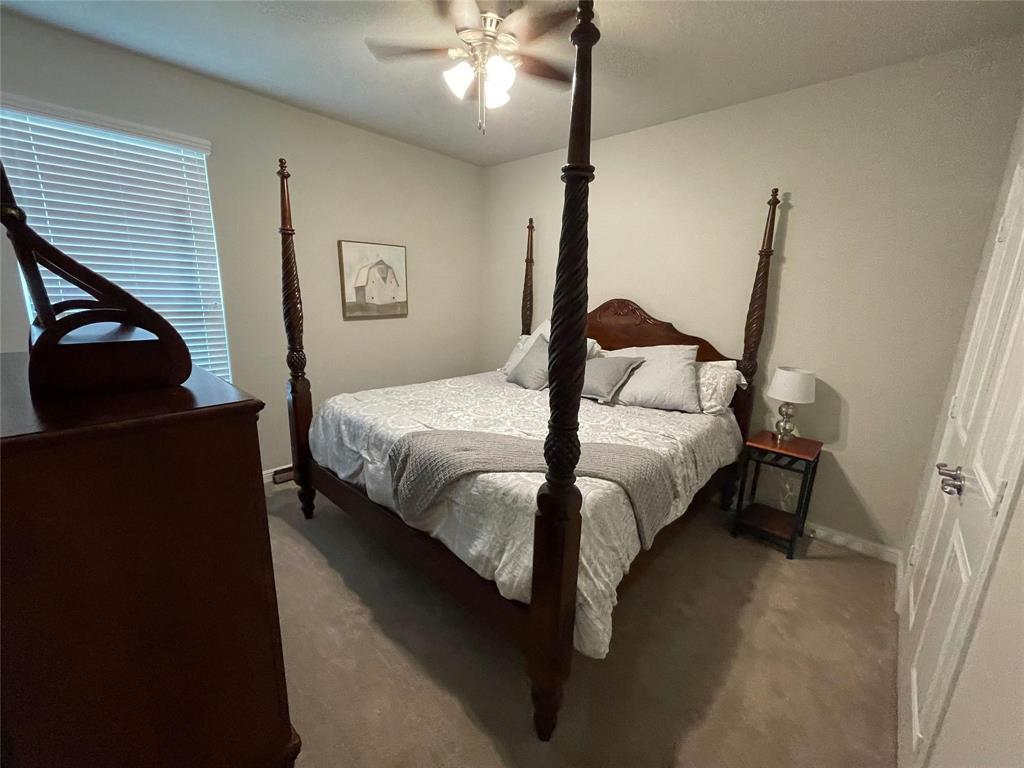 1904 Cardinal Way Argyle, TX 76226 - Photo 11 of 17 a bedroom with a bed and a chandelier