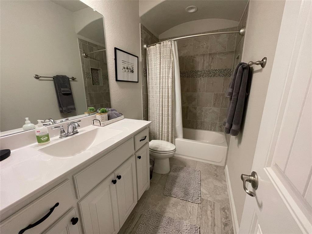 1904 Cardinal Way Argyle, TX 76226 - Photo 8 of 17 a bathroom with a sink a toilet and shower