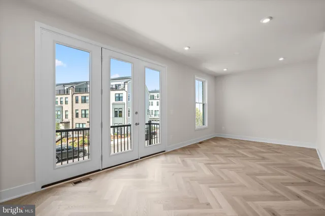 a view of an empty room with windows