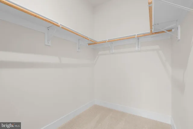 a bathroom with double vanity sinks and a mirror