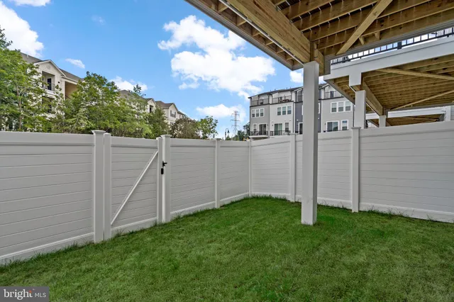 a front view of a brick building with large windows