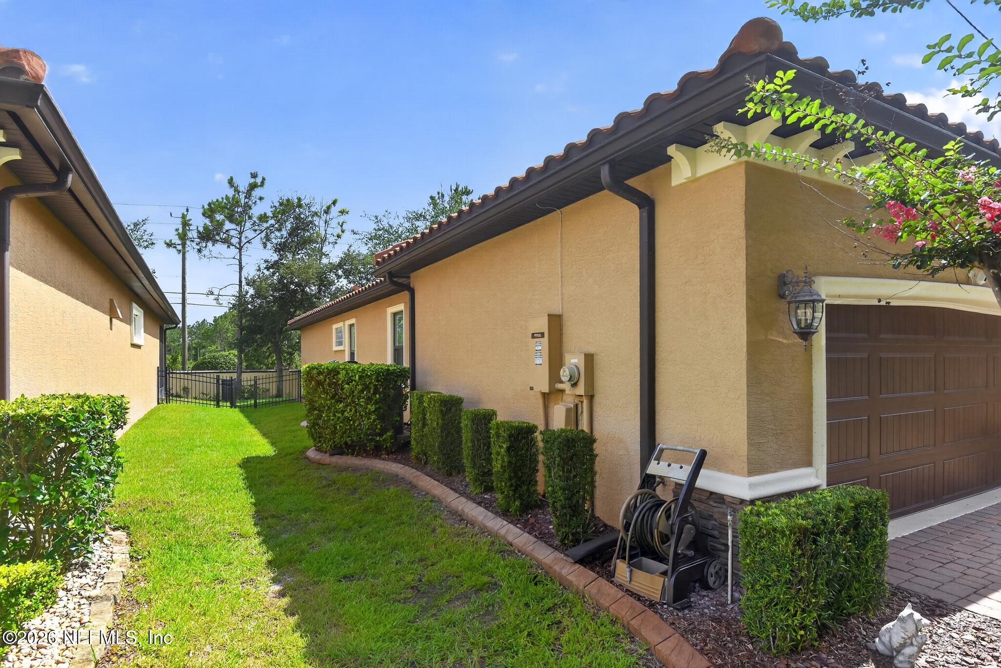 110 Vía Roma Ormond Beach, FL 32174 - Photo 35 of 43 a front view of a house with garden
