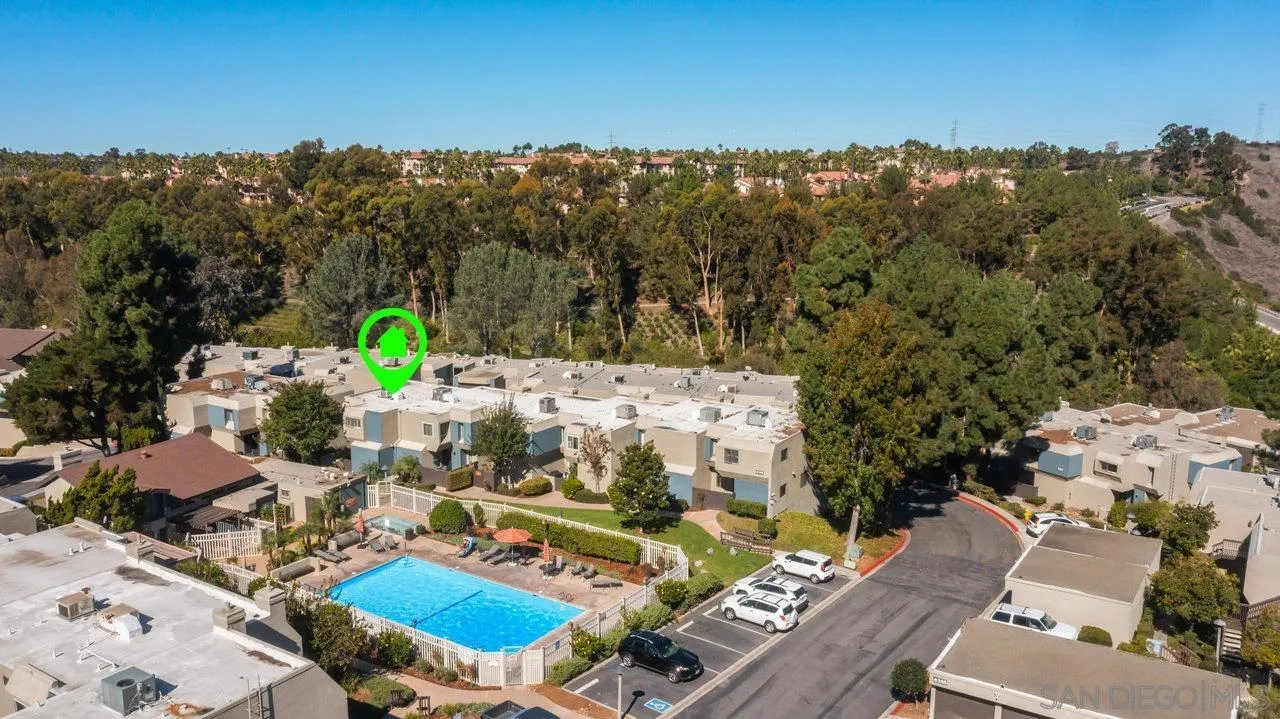6381 Rancho Mission Road, Unit 6 San Diego, CA 92108 - Photo 2 of 30 a view of a swimming pool with a patio