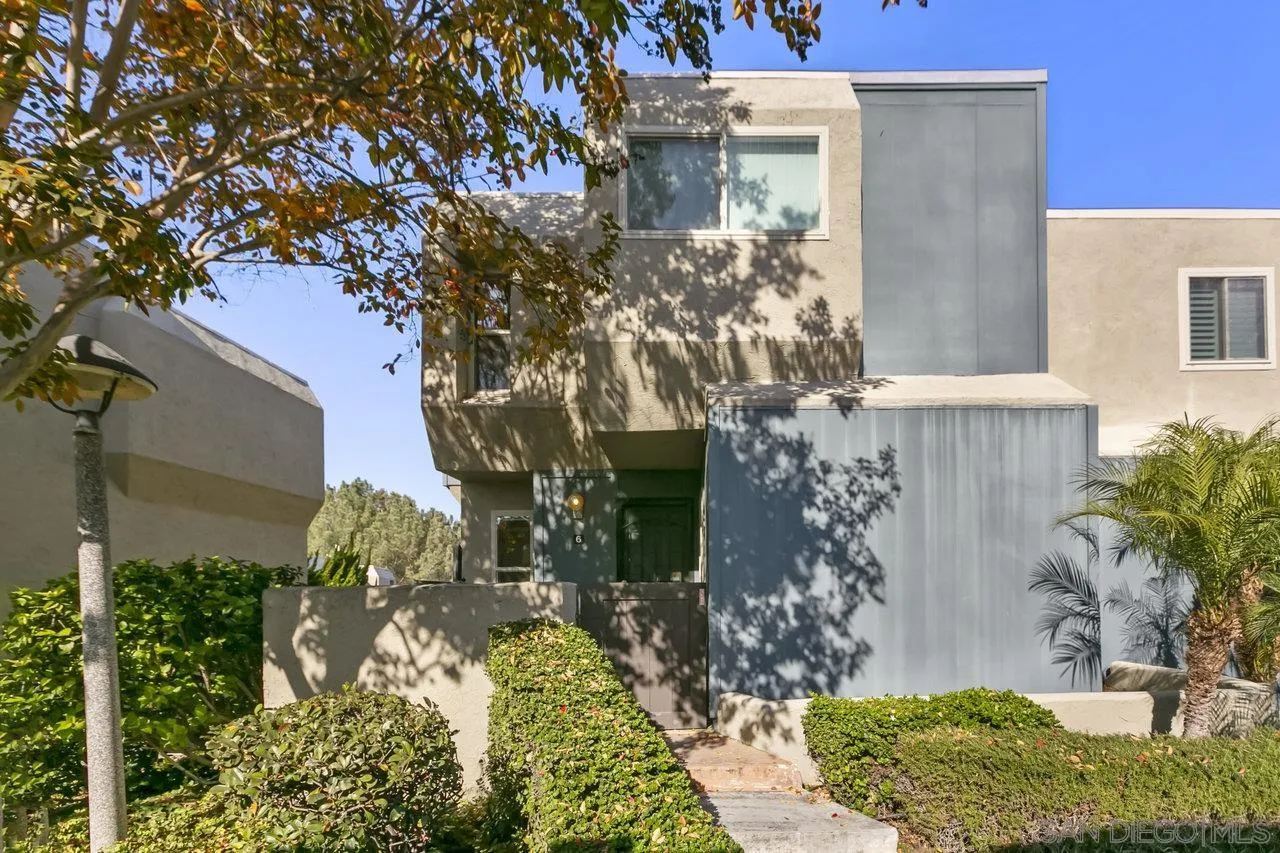 6381 Rancho Mission Road, Unit 6 San Diego, CA 92108 - Photo 24 of 30 a front view of a house with a yard