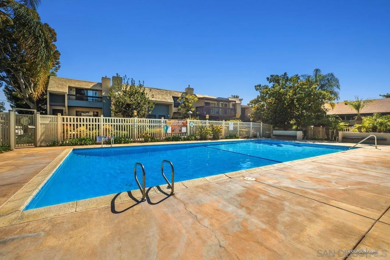 6381 Rancho Mission Road, Unit 6 San Diego, CA 92108 - Photo 26 of 30 a view of a swimming pool with a terrace