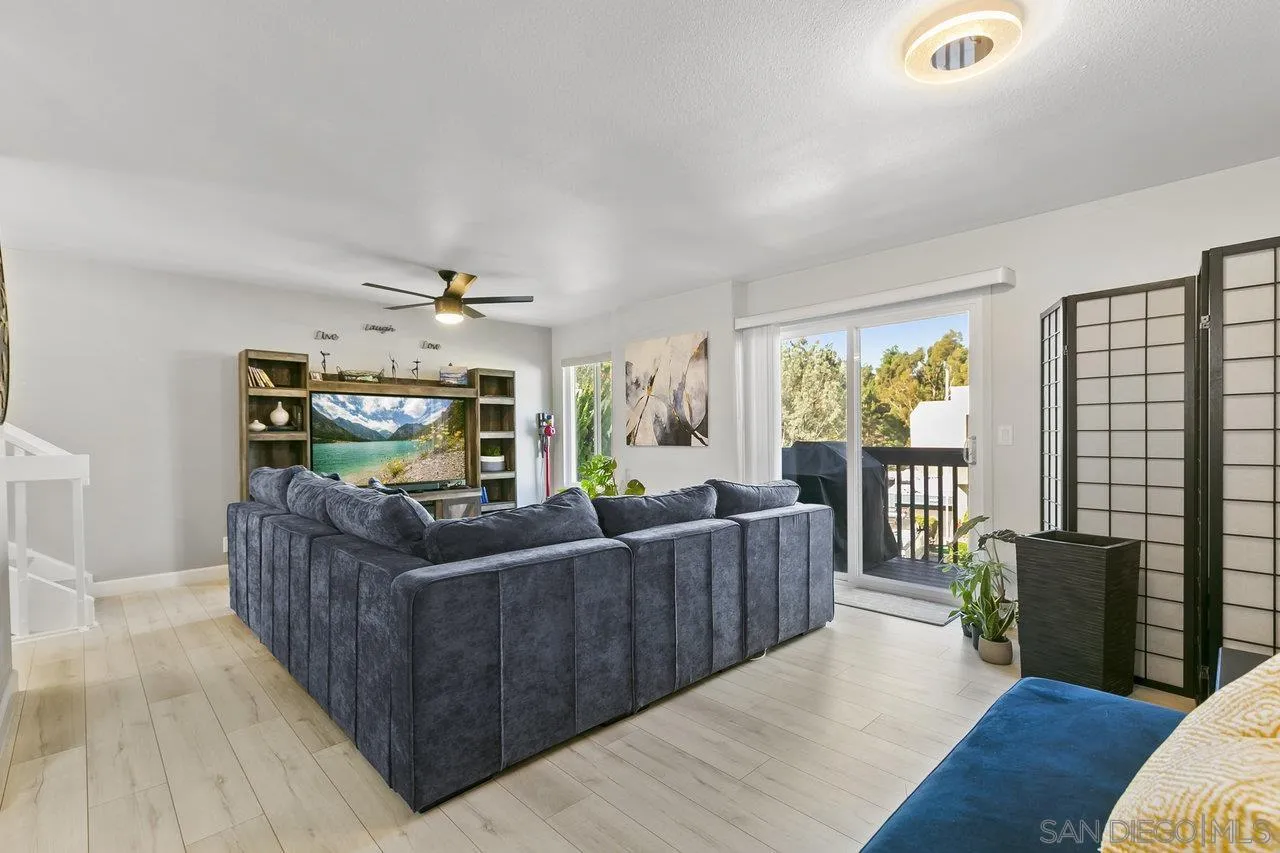 6381 Rancho Mission Road, Unit 6 San Diego, CA 92108 - Photo 3 of 30 a living room with furniture and a fireplace