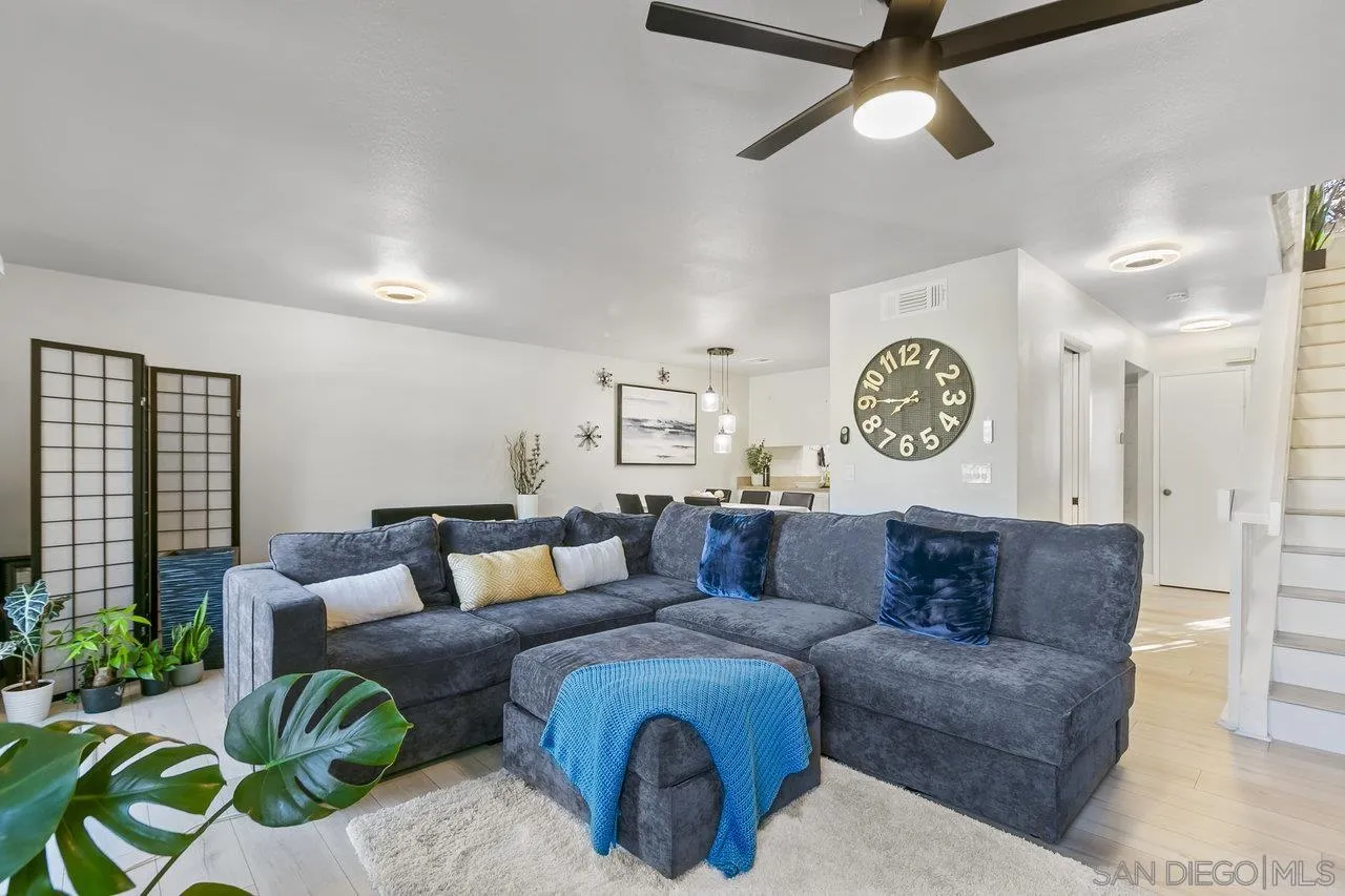 6381 Rancho Mission Road, Unit 6 San Diego, CA 92108 - Photo 5 of 30 a living room with furniture and a large window
