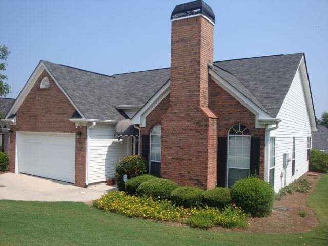 15 Mill Ridge Place Newnan, GA 30263 - Photo 1 of 1 a front view of a house with a yard and garage