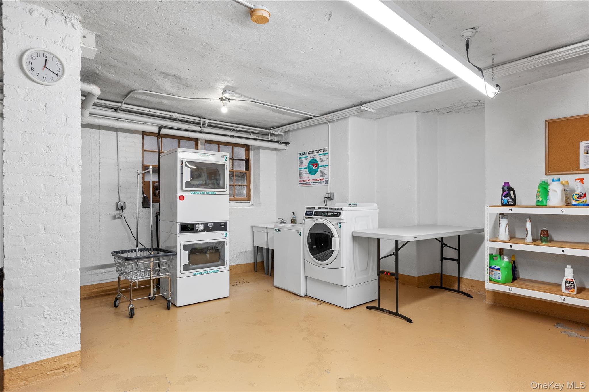 60 Pinewood Road, Unit 1B Hartsdale, NY 10530 - Photo 17 of 27 Community laundry room with washing machine and dryer.