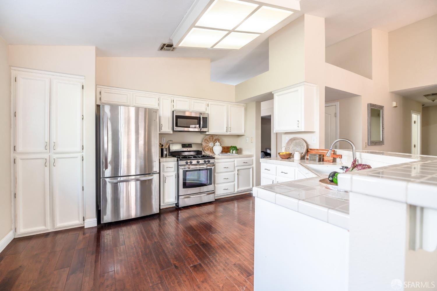 4603 Chelsea Drive Oakley, CA 94561 - Photo 11 of 36 a kitchen with stainless steel appliances a refrigerator sink and microwave