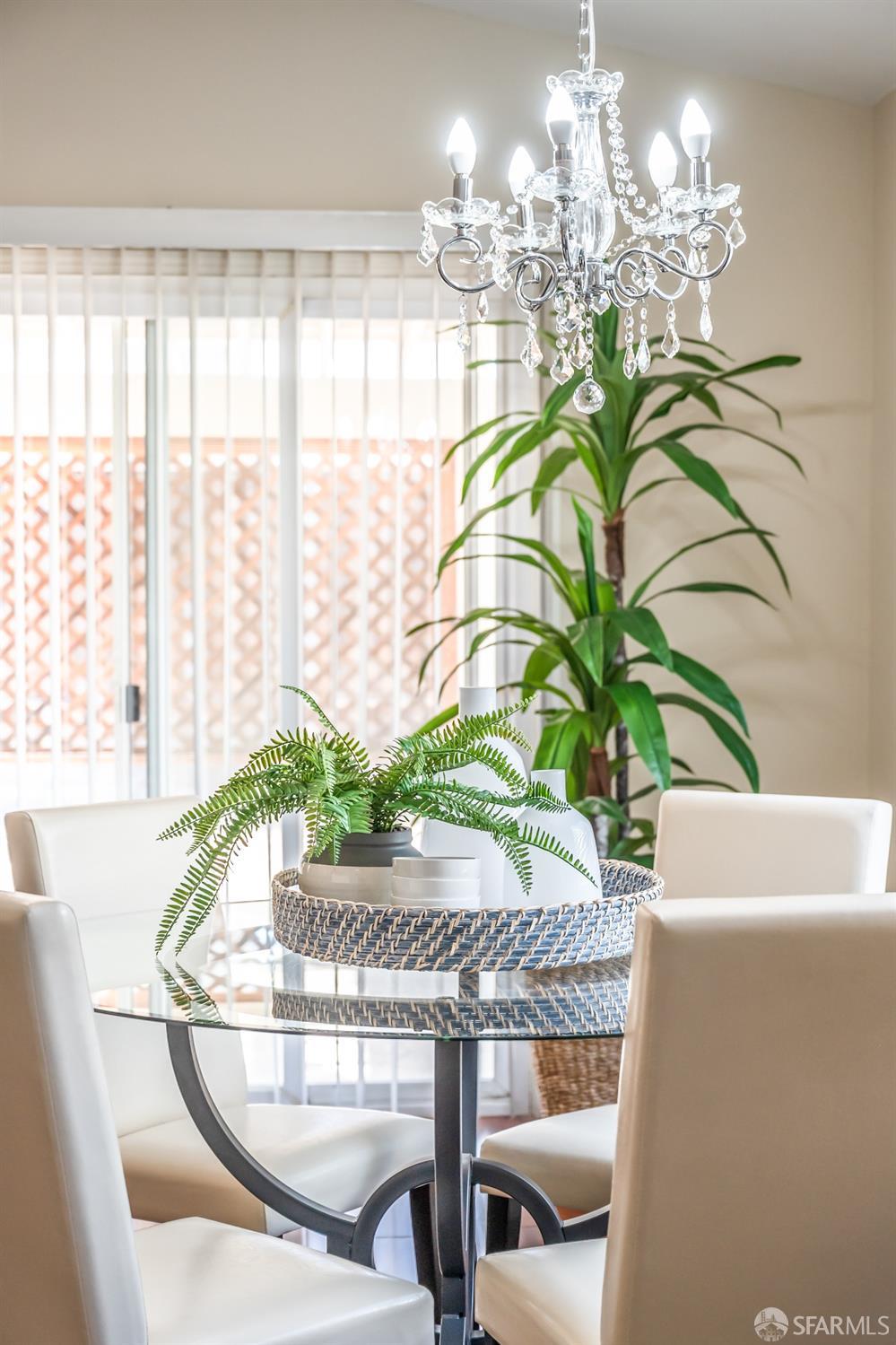 4603 Chelsea Drive Oakley, CA 94561 - Photo 14 of 36 a vase of flowers sitting on a table with a chandelier