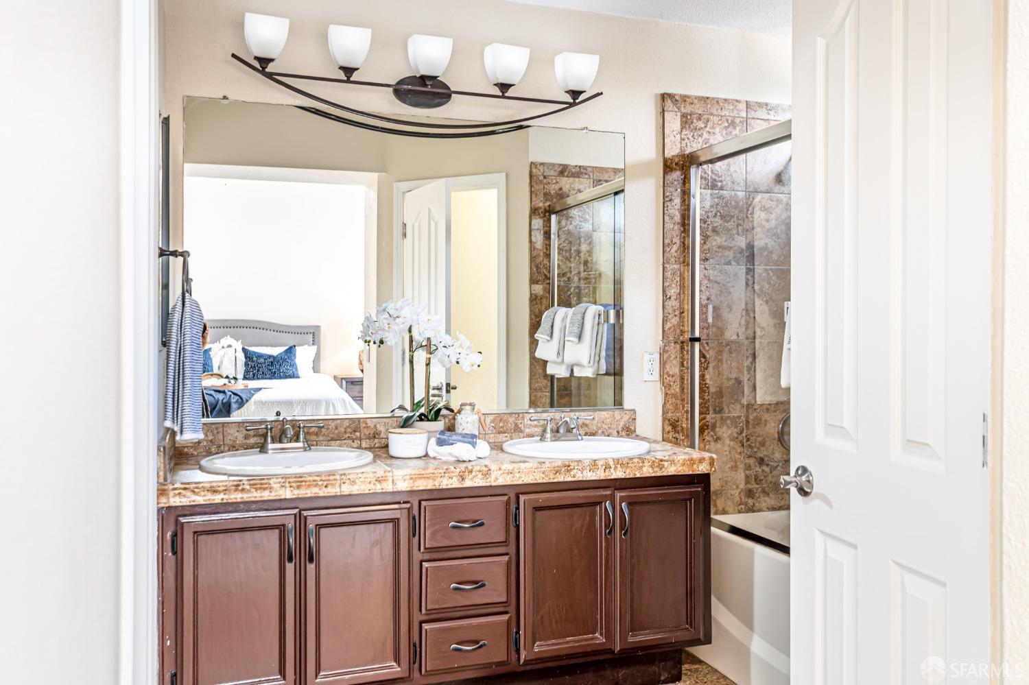 4603 Chelsea Drive Oakley, CA 94561 - Photo 20 of 36 a bathroom with a granite countertop sink and a mirror