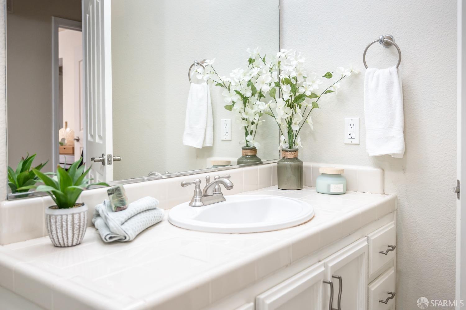 4603 Chelsea Drive Oakley, CA 94561 - Photo 22 of 36 a bathroom with a sink a vanity and a mirror