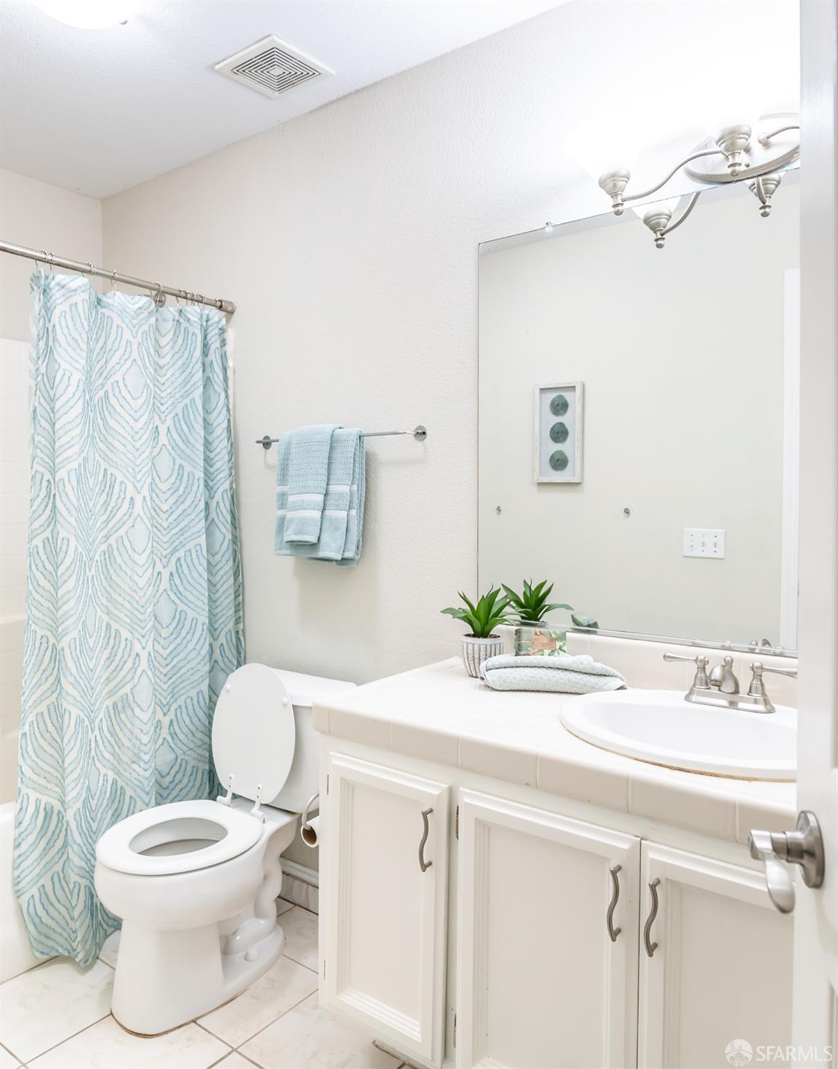 4603 Chelsea Drive Oakley, CA 94561 - Photo 23 of 36 a bathroom with a sink a toilet and a mirror