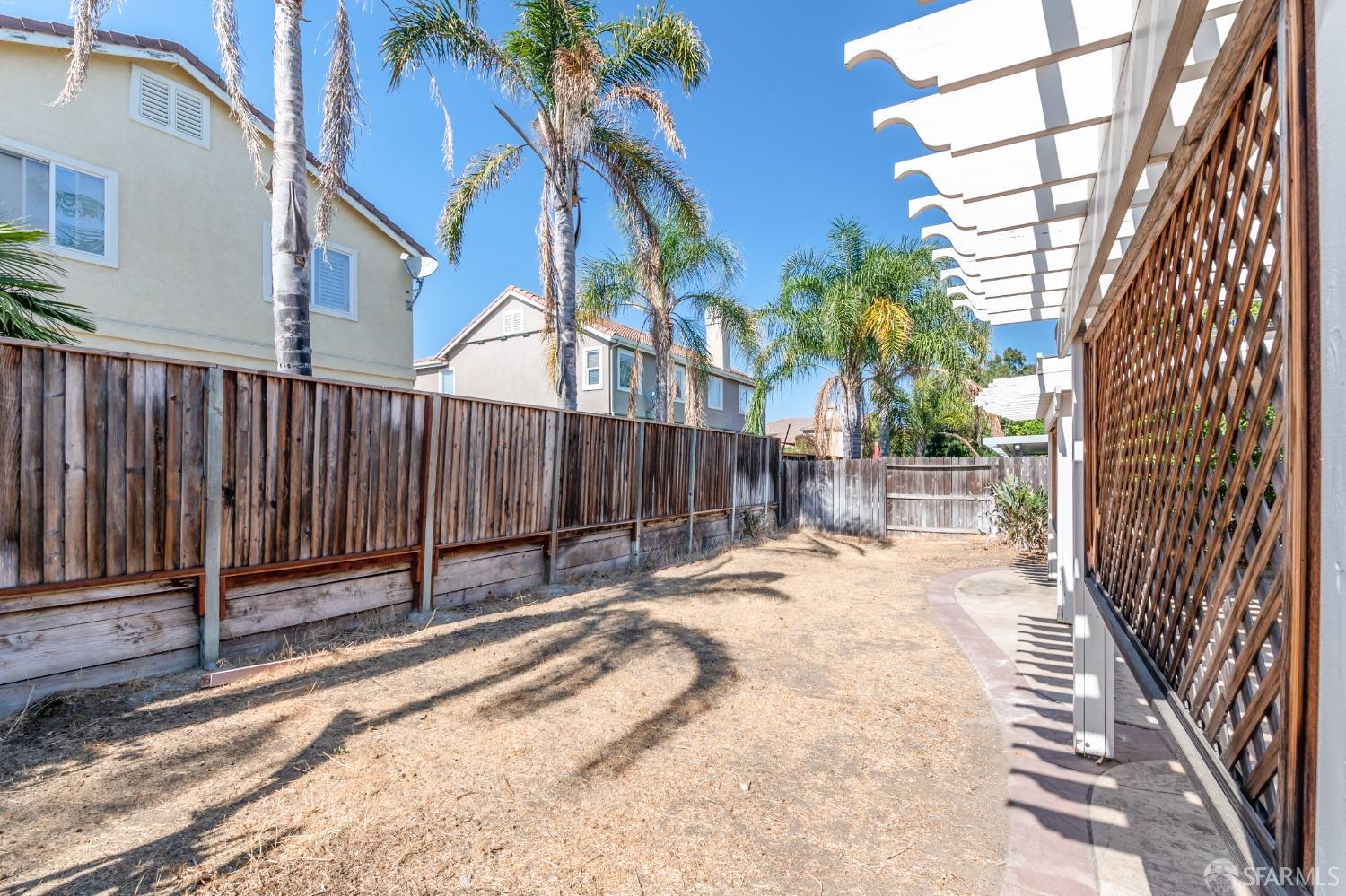 4603 Chelsea Drive Oakley, CA 94561 - Photo 33 of 36 a view of backyard with wooden fence and large trees