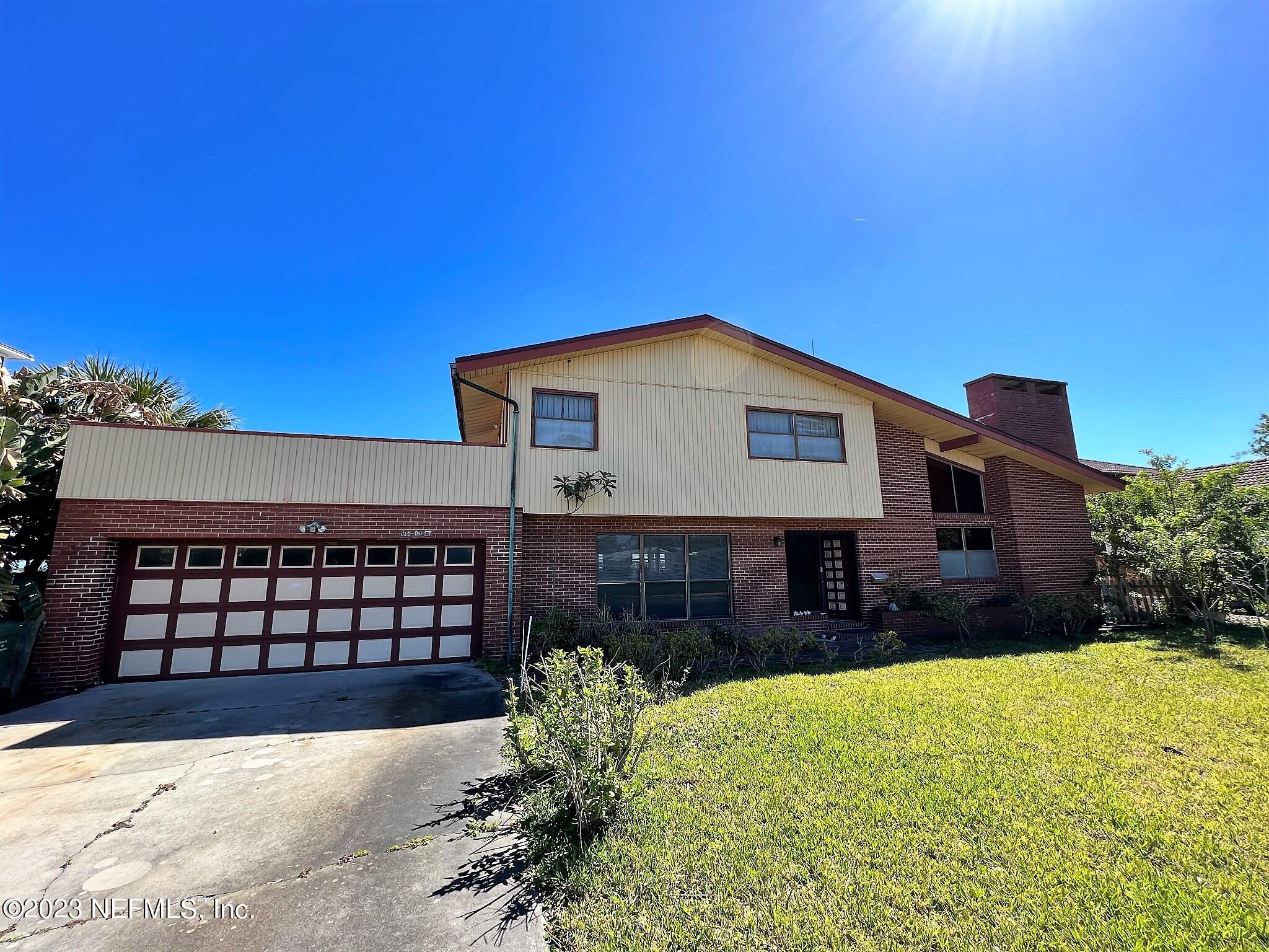 111 Inlet Drive St. Augustine, FL 32080 - Photo 11 of 11 a front view of a house with a yard