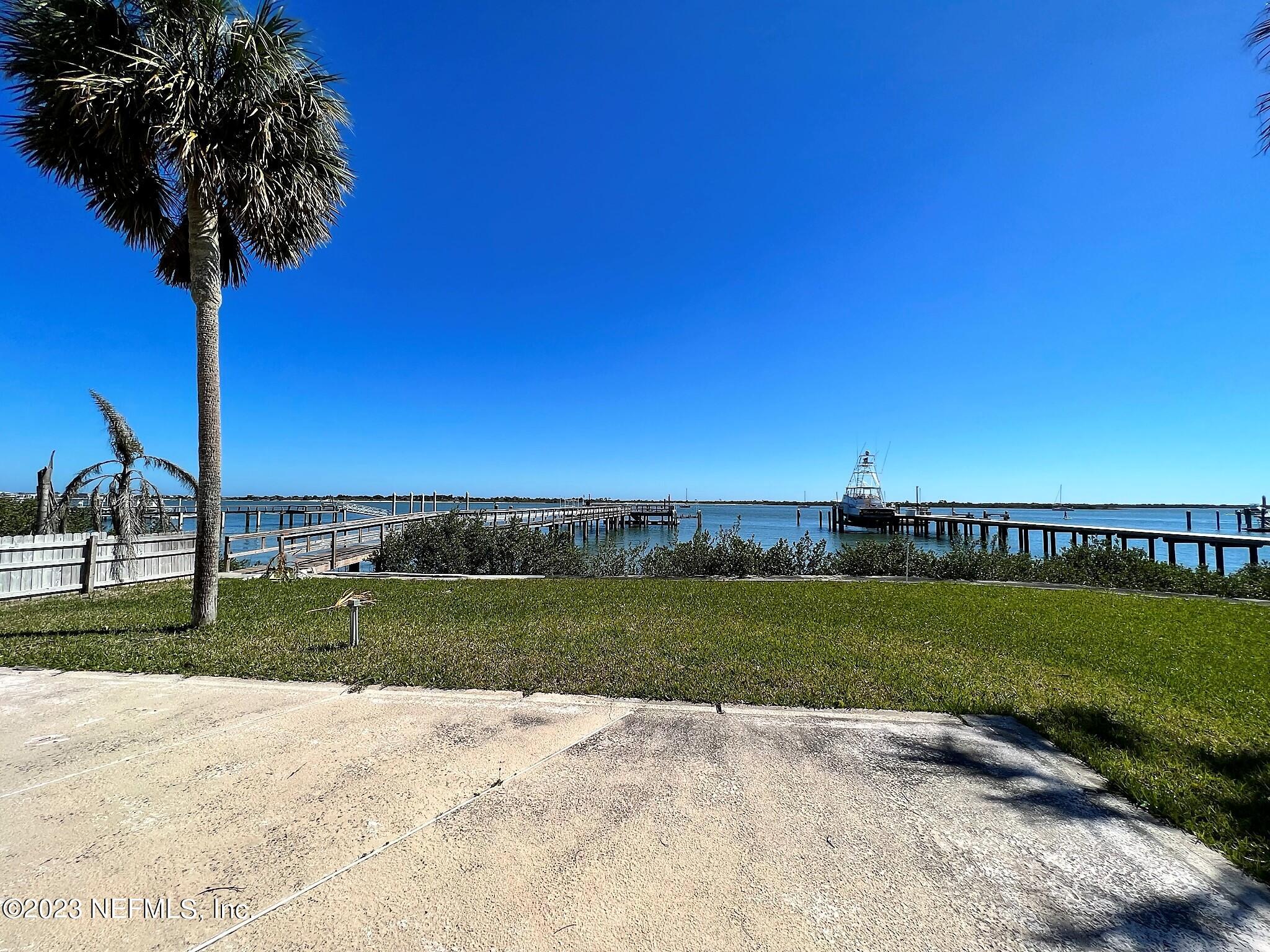 111 Inlet Drive St. Augustine, FL 32080 - Photo 2 of 11 a view of a park with a big yard and palm trees