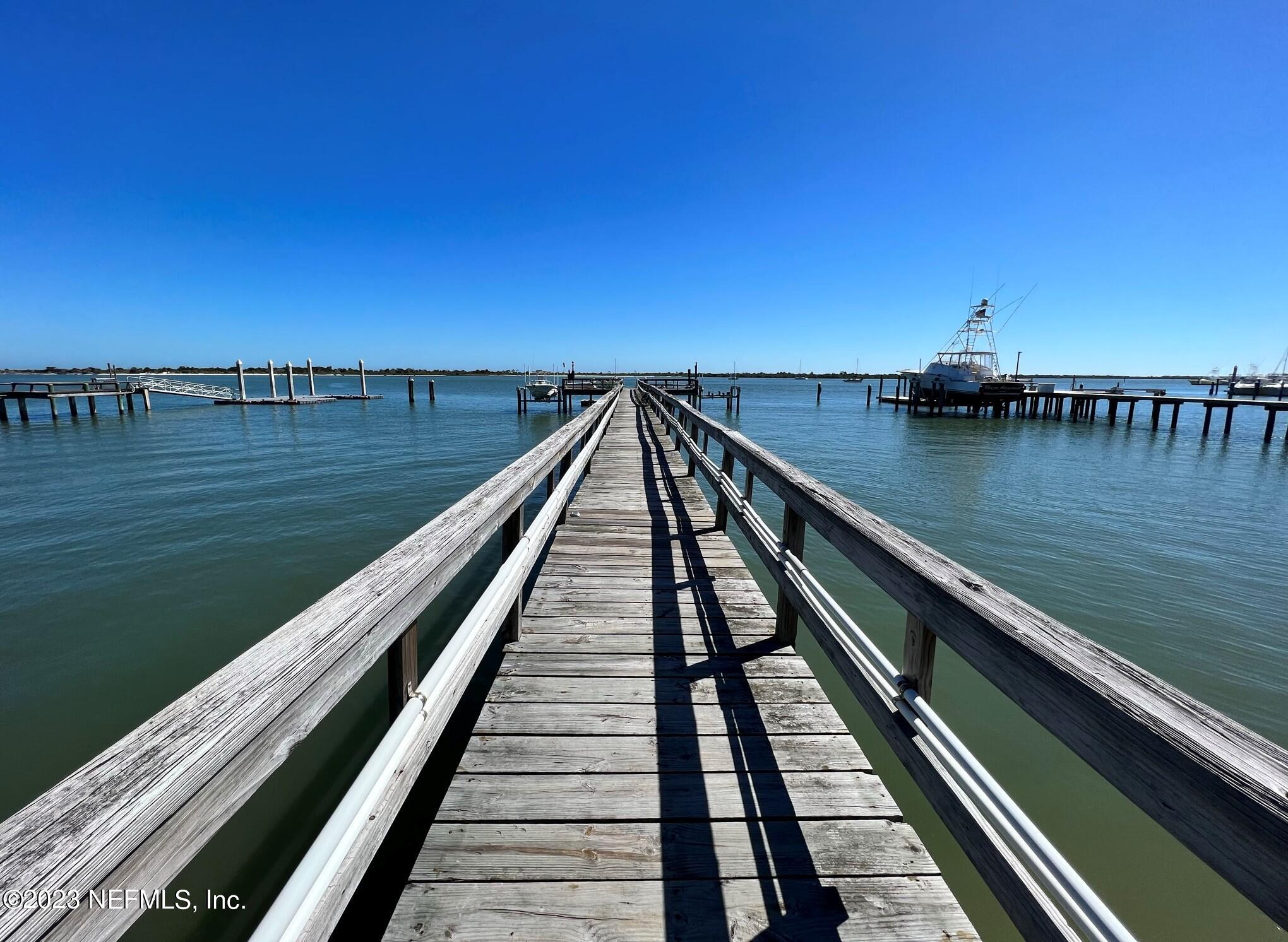 111 Inlet Drive St. Augustine, FL 32080 - Photo 4 of 11 a view of a balcony with wooden floor and lake