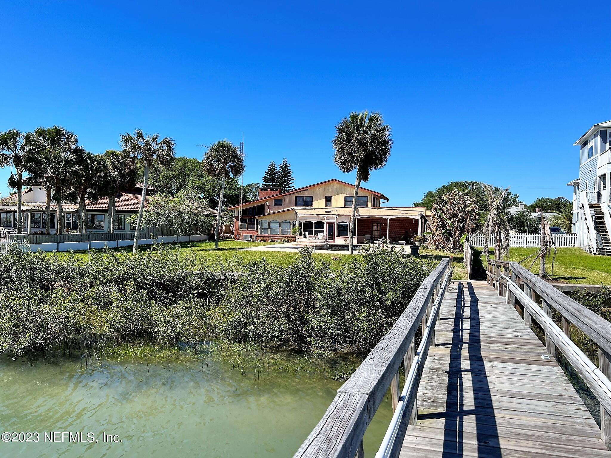 111 Inlet Drive St. Augustine, FL 32080 - Photo 9 of 11 a front view of a house with a yard