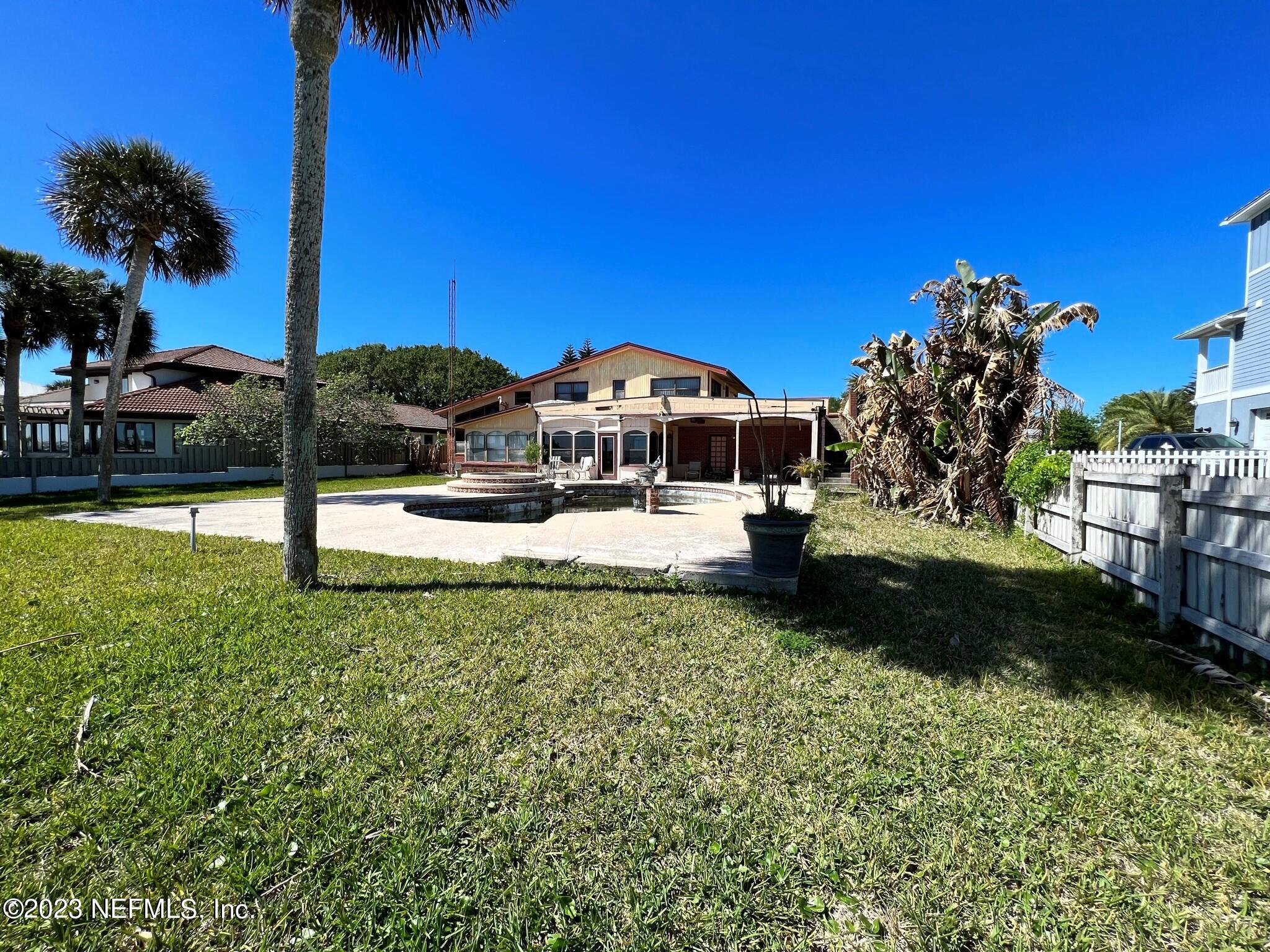 111 Inlet Drive St. Augustine, FL 32080 - Photo 10 of 11 a view of a house with a yard and sitting area