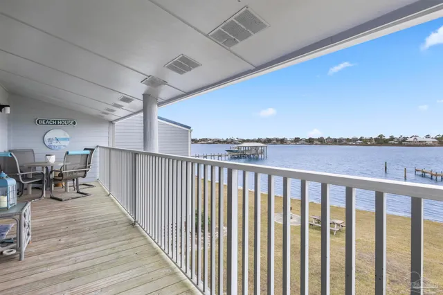 a dining room with table & chairs and wooden floor
