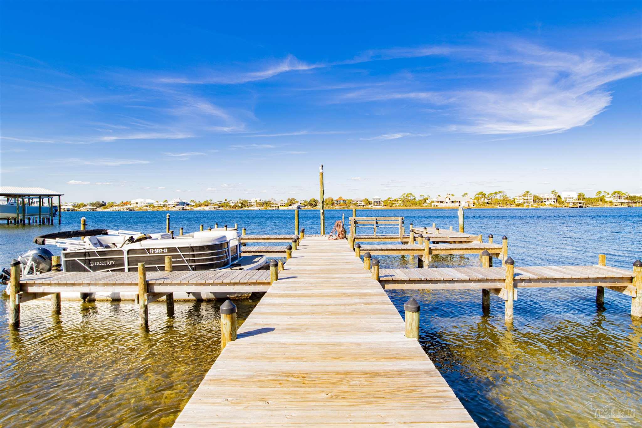 16470 Perdido Key Drive, Unit C24 Perdido Key, FL 32507 - Photo 26 of 48 a view of a chairs and tables in the patio