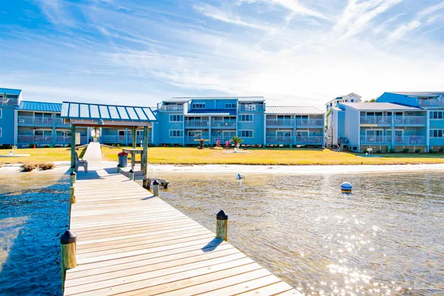 a view of swimming pool with outdoor seating and yard in the back