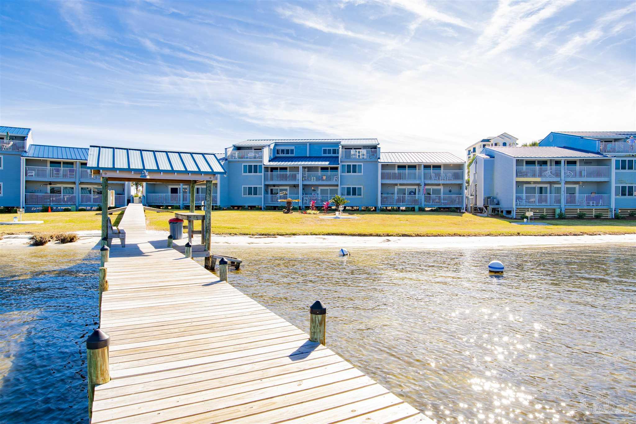 16470 Perdido Key Drive, Unit C24 Perdido Key, FL 32507 - Photo 27 of 48 a view of swimming pool with outdoor seating and yard in the back