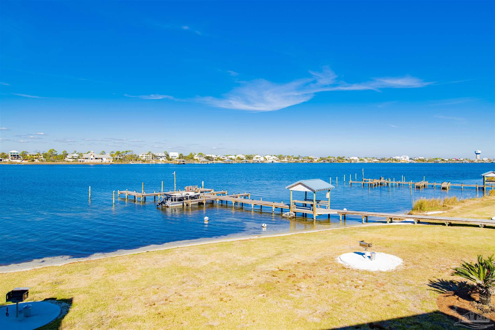 16470 Perdido Key Drive, Unit C24 Perdido Key, FL 32507 - Photo 34 of 48 a view of a swimming pool with an ocean view