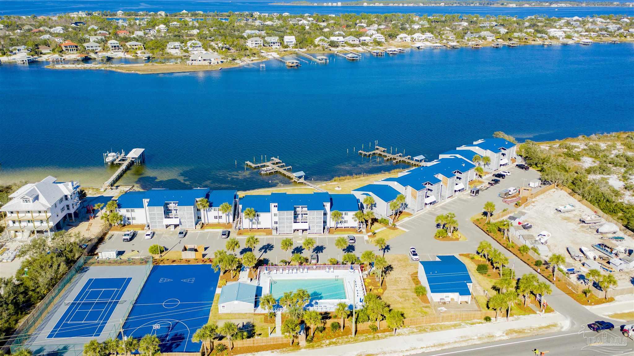 16470 Perdido Key Drive, Unit C24 Perdido Key, FL 32507 - Photo 7 of 48 a view of an ocean with a floor to ceiling window and potted plants