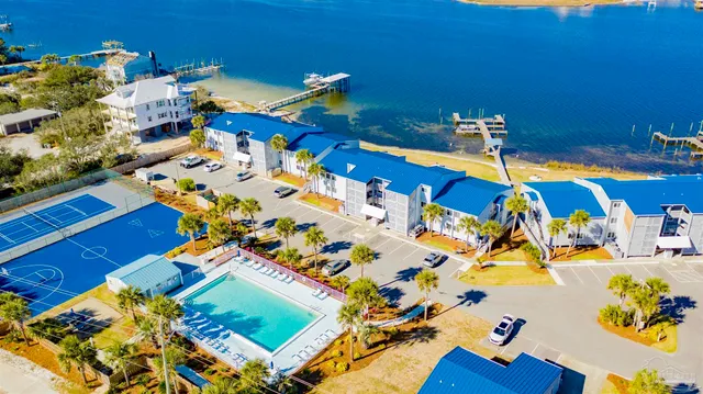 an aerial view of a house a yard swimming pool and outdoor space