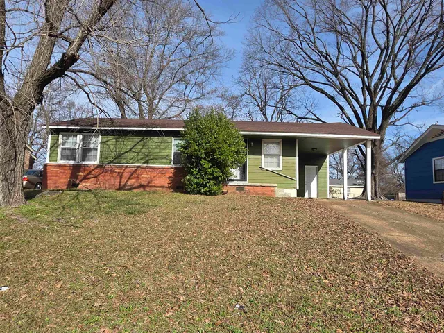 front view of a house with a yard