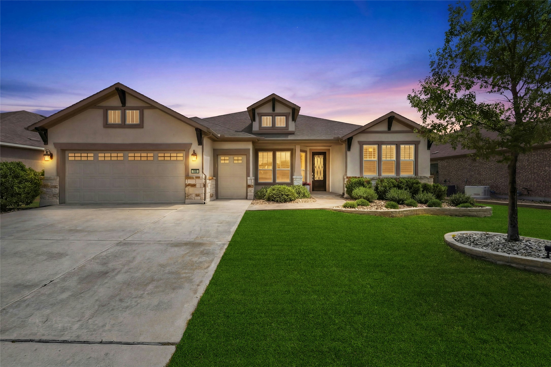 105 Marfa Cove Georgetown, TX 78633 - Photo 1 of 36 a front view of a house with a garden and yard