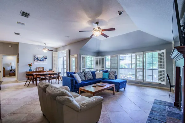 a living room with furniture and a large window