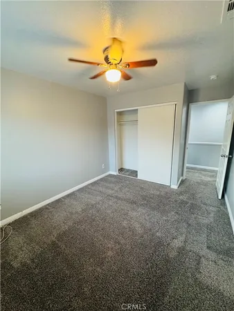 a living room with a bed and furniture