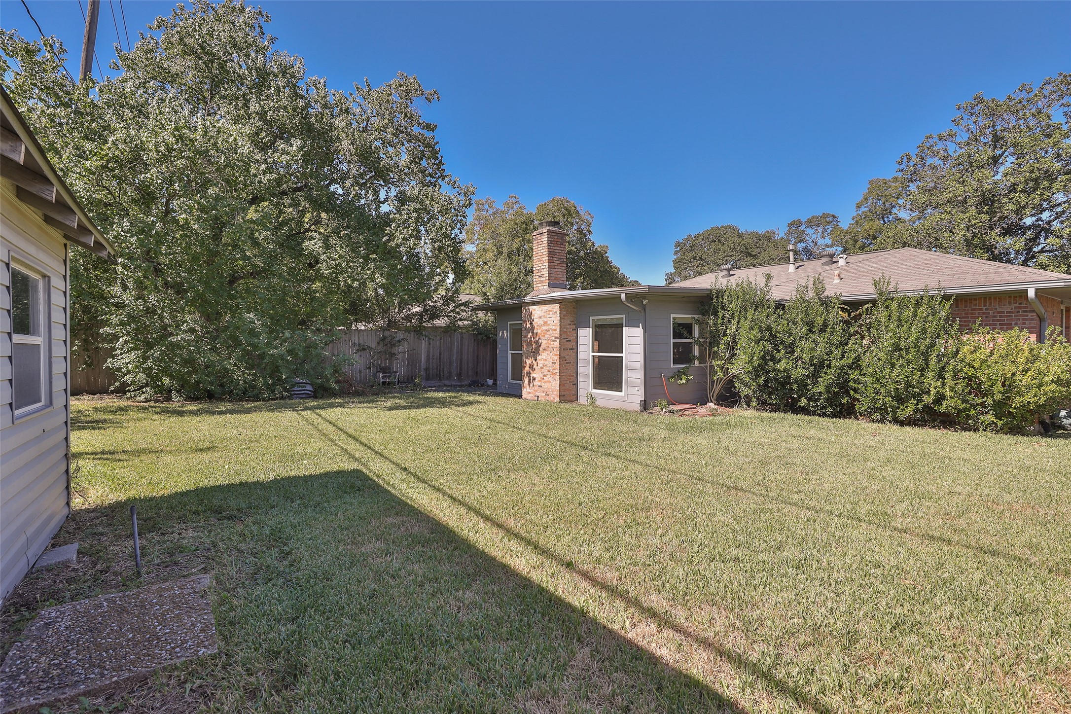 4613 Libbey Drive Houston, TX 77092 - Photo 21 of 26 a view of a house with pool and a yard