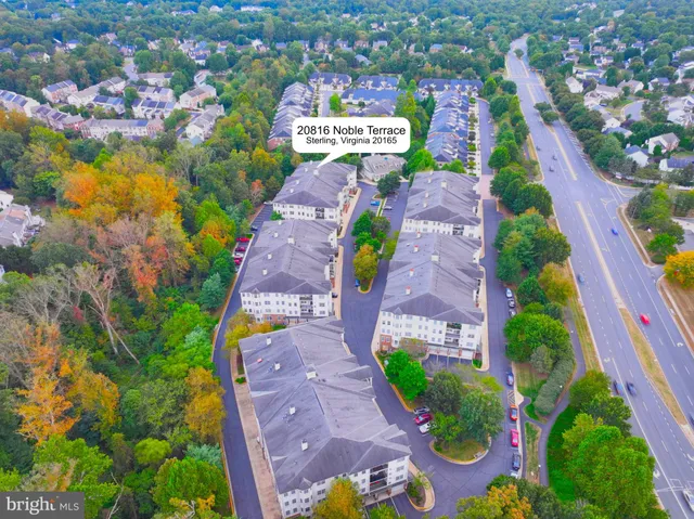 an aerial view of residential house with outdoor space and swimming pool