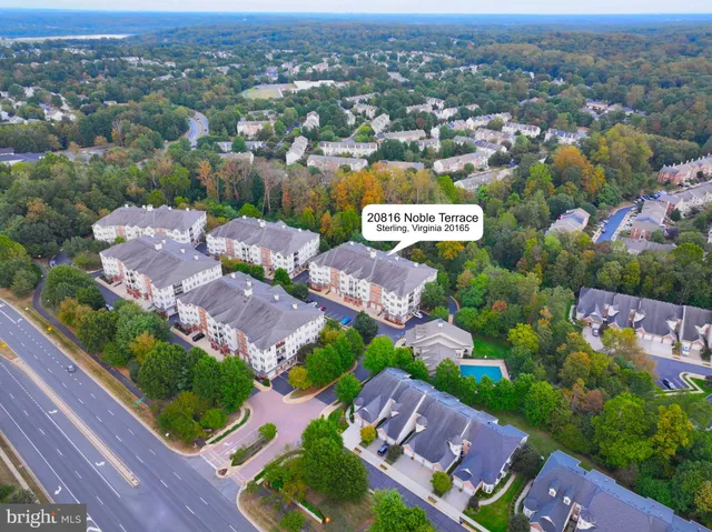 an aerial view of residential houses with outdoor space