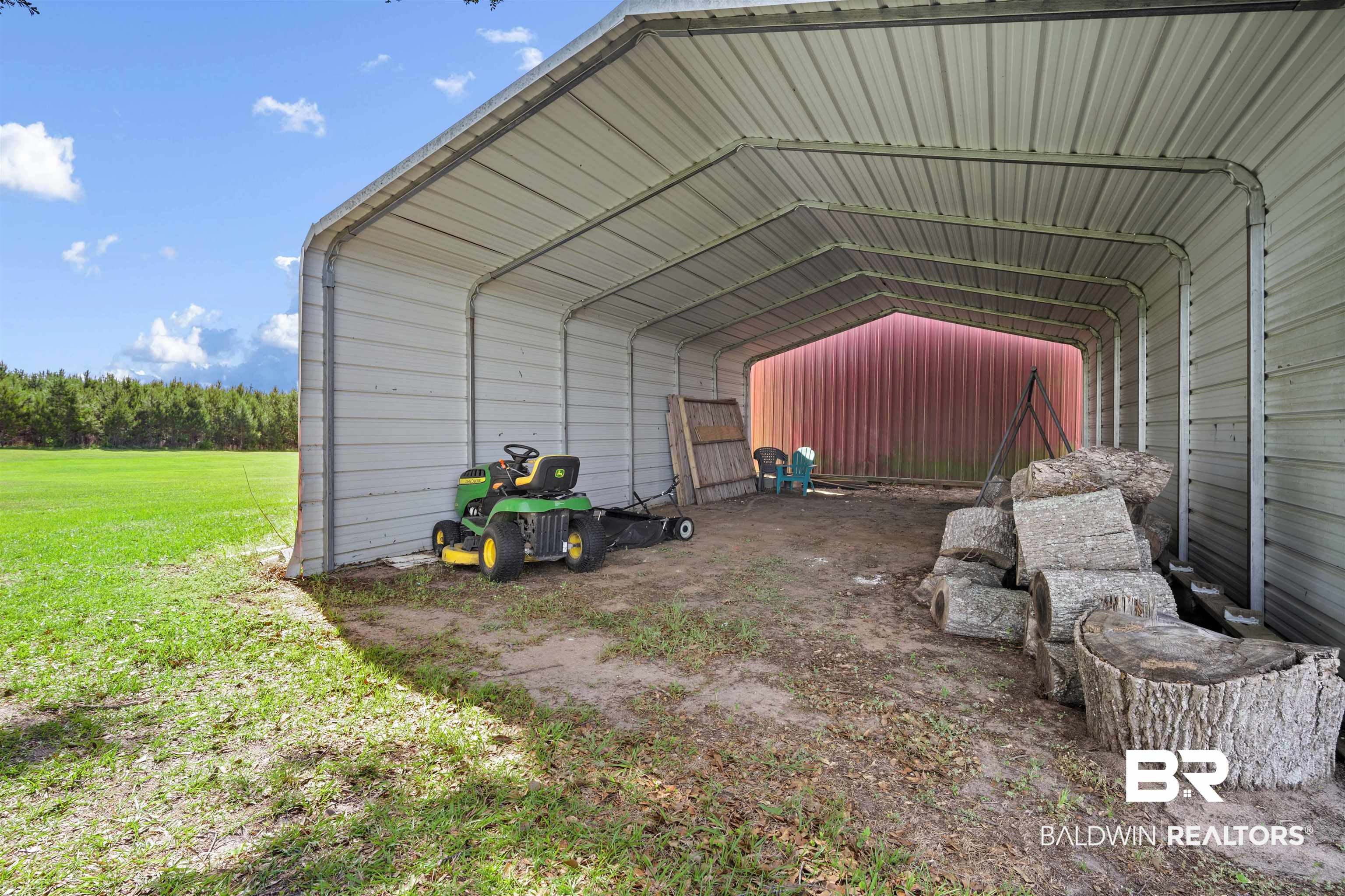 22 Horace Odom Road Millry, AL 36558 - Photo 37 of 39 View of outdoor structure featuring a detached carport