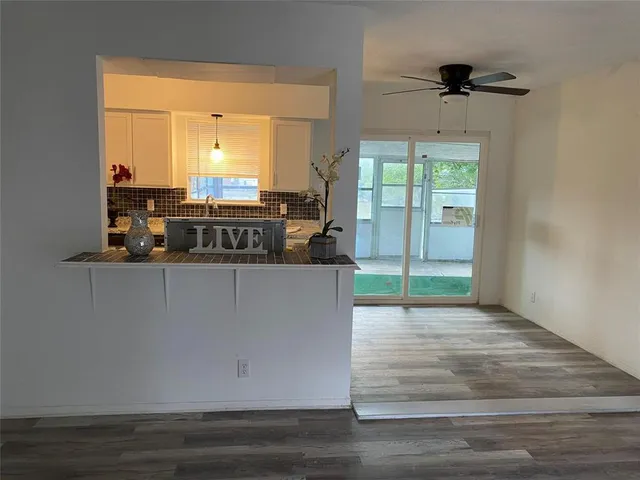 a living room with a wooden floor