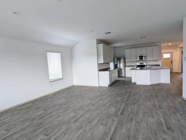 a view of kitchen with sink and wooden floor