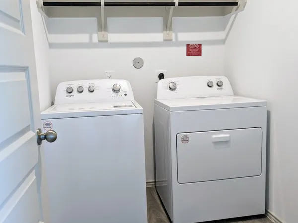 a utility room with dryer and washer