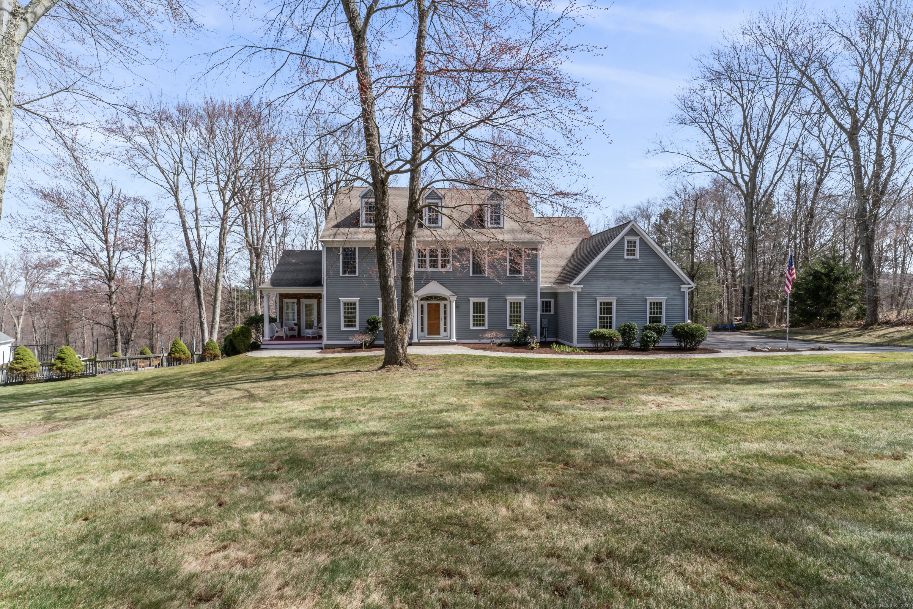 52 Cobblers Mill Road Newtown, CT 06482 - Photo 1 of 1 a front view of a house with a yard