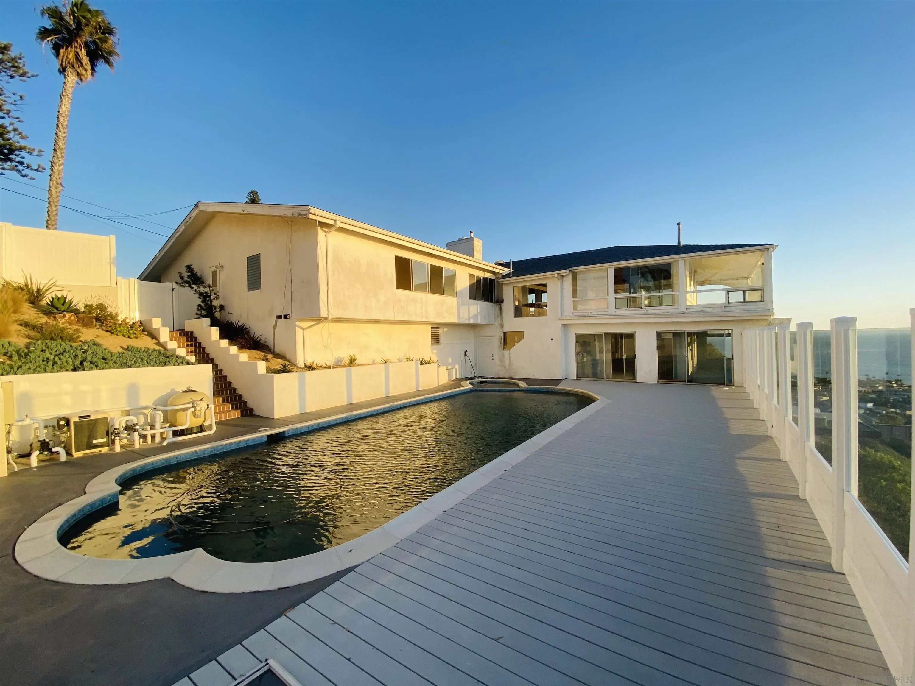856 La Jolla Rancho Road La Jolla, CA 92037 - Photo 8 of 18 a view of a balcony with wooden floor and a potted plant
