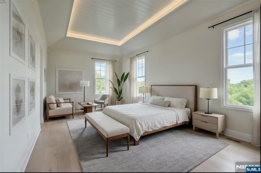 51 Brookside Terrace North Caldwell, NJ 07006 - Photo 6 of 12 a bedroom with a bed couch and a large window