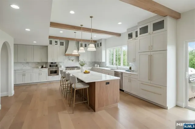 a kitchen with counter top space and sink