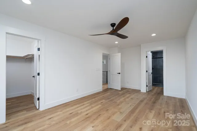 a view of an empty room and wooden floor