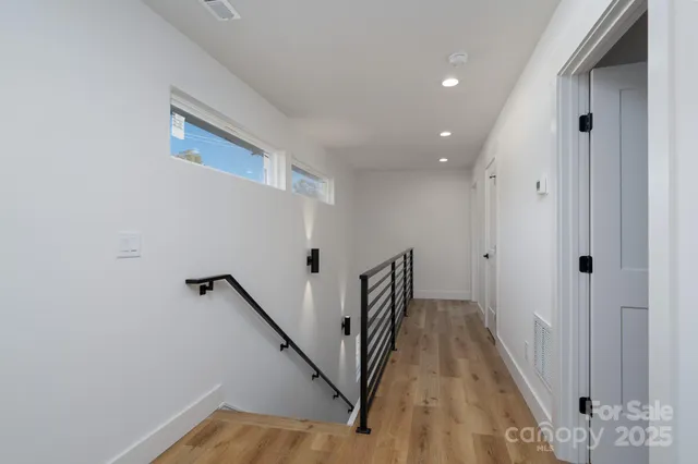 a view of a hallway with stairs