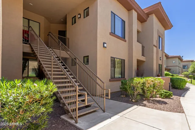a view of front door of house with stairs